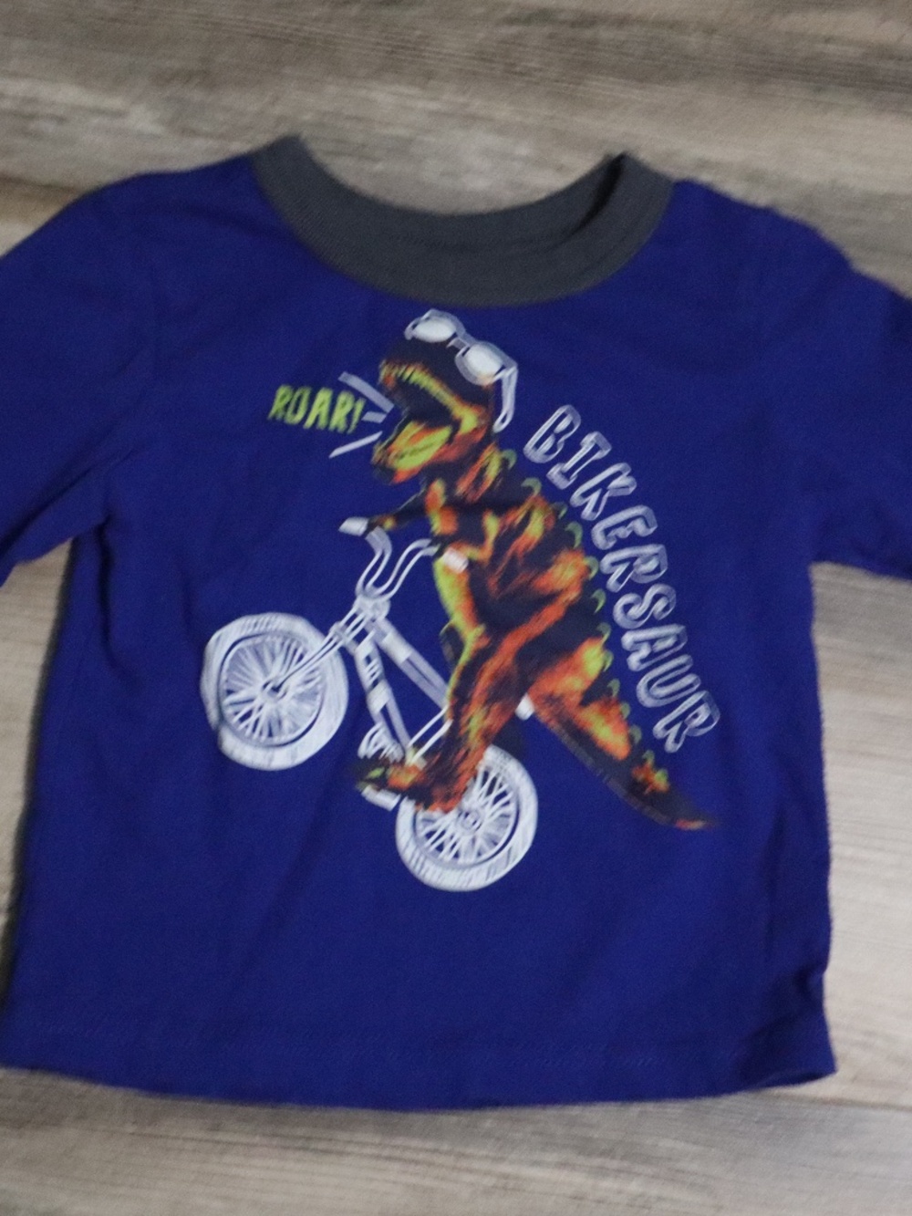 Long sleeve boys dinosaur on bike shirt